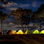 tent glowing at night with lights campsite に関連するアウトドア写真